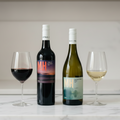 MH Wine Bottles on Marble Benchtop with Red Wine